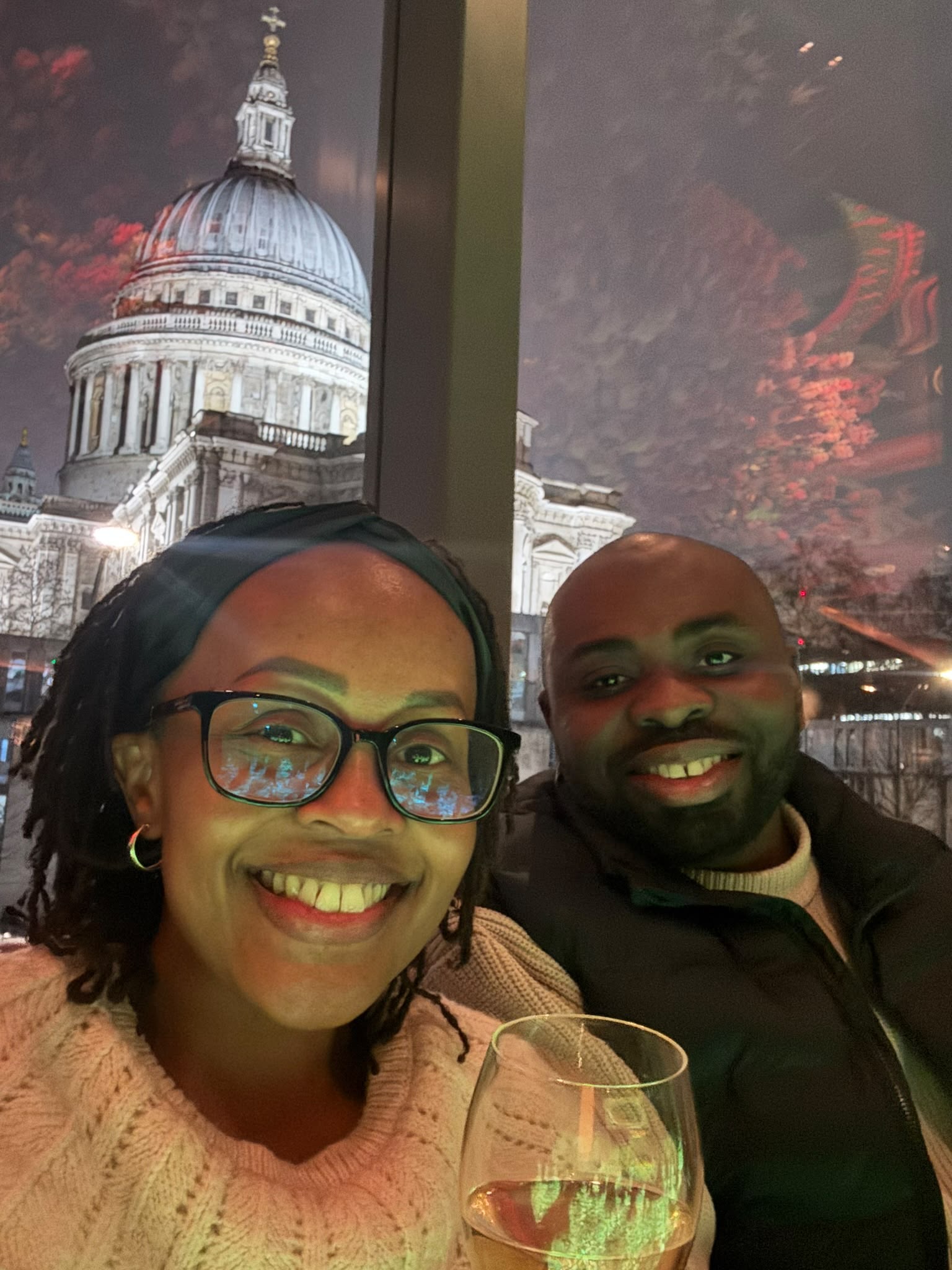 Leo and Njoki at dinner with a view of St Paul&rsquo;s