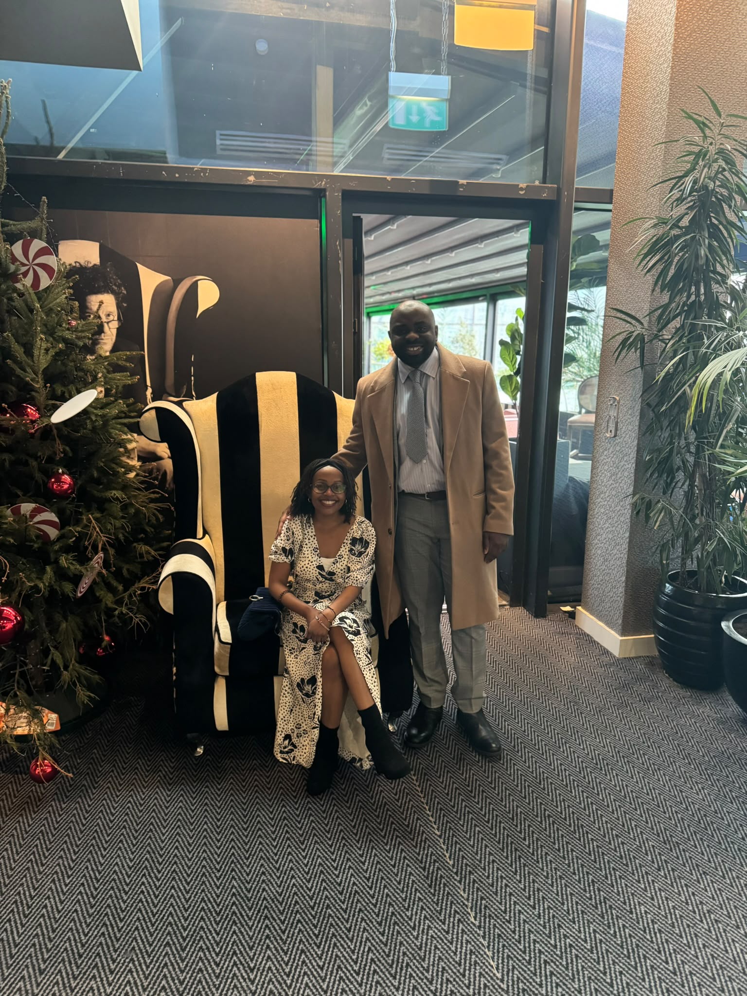 Leo and Njoki by the Christmas tree